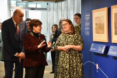 Dame Patsy Reddy looking at the Christopher Aubrey exhibition