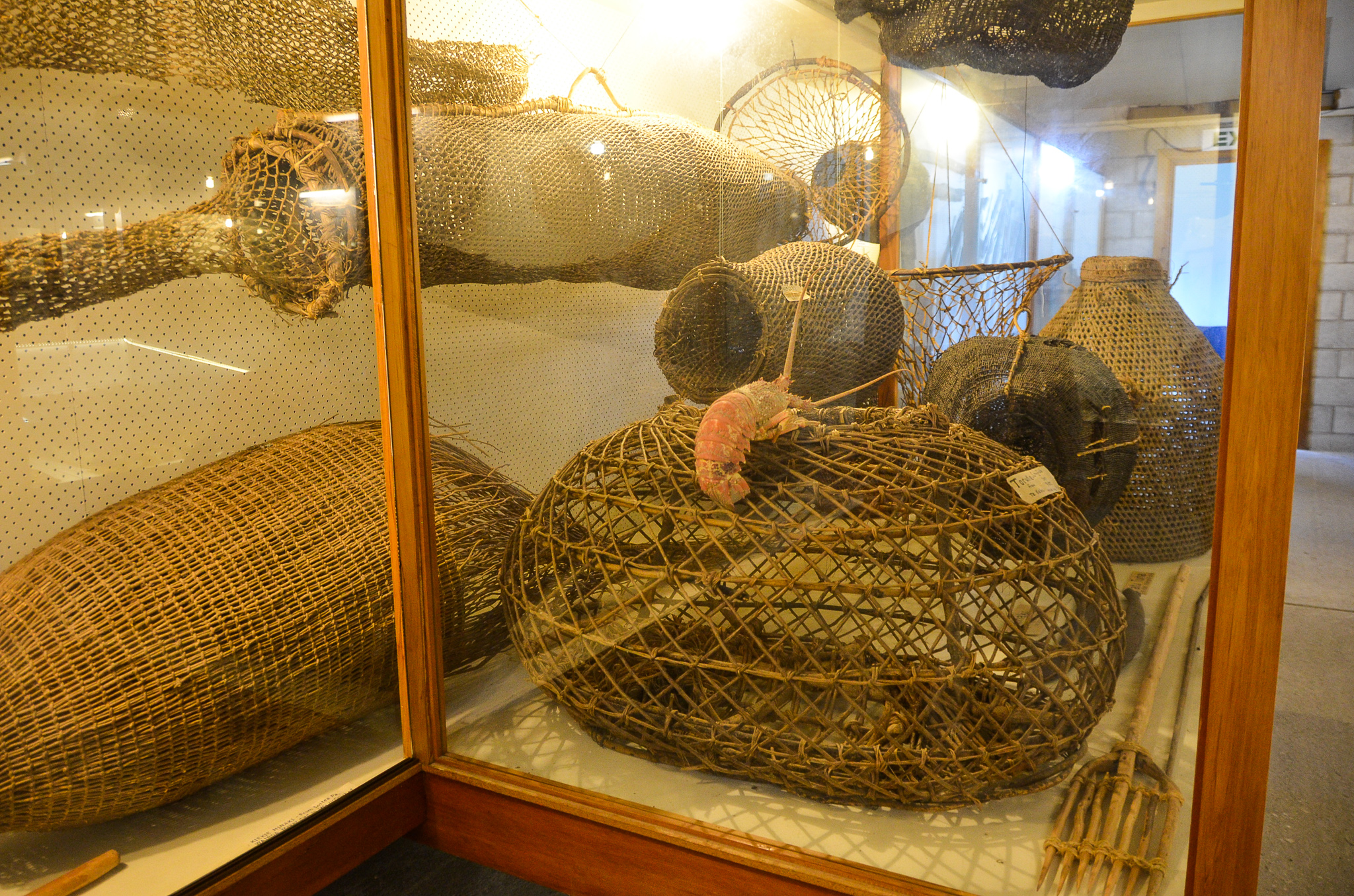 These traditional Maori fishing nets and traps come from the local area ...