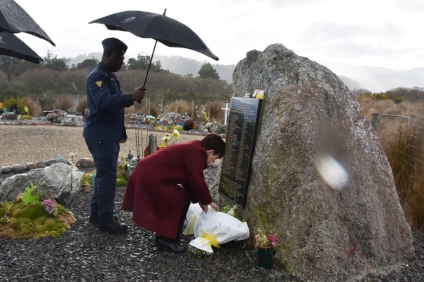 Image of Dame Patsy laying flowers at the Pike River Memorial