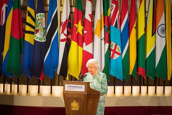 The Queen addresses the Commonwealth from a podium
