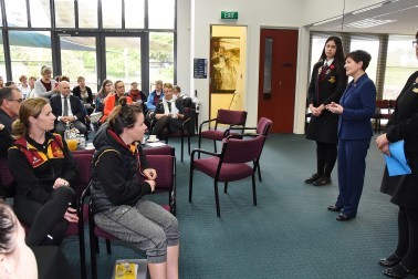 an image of Dame Patsy responding to questions from the staff