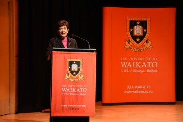 an image of Dame Patsy addressing the delegates