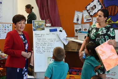 an image of Dame Patsy with new entrant children at Kaitaia Primary School