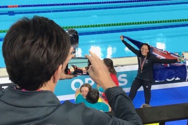 Image of Dame Patsy taking Sophie Pascoe's photo after her gold medal win