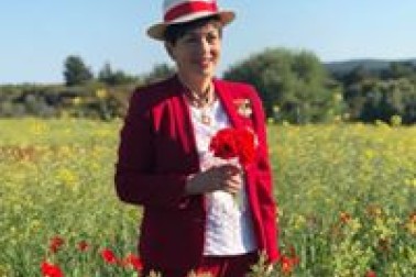 an image of Dame Patsy and poppies at Gallipoli