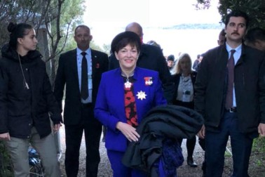 an image of Dame Patsy leaving the Anzac Dawn Service