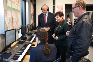 an image of Dame Patsy and Sir David hearing a student's composition in the music lab