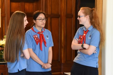 Image of  Girl Guides chatting before their award presentation 