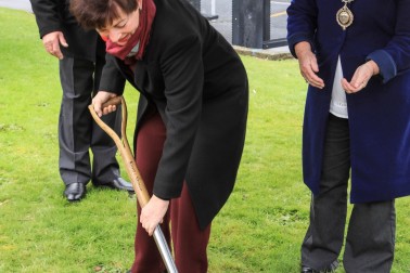 an image of Dame Patsy turning a sod for the Paul Dibble sculpture