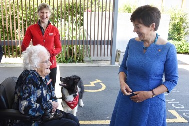 Image of Dame Patsy meeting Eileen Curry, who started Canine Friends Pet Therapy in Wellington