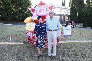 Image of Dame Patsy and Sir David with a pig shaped lantern