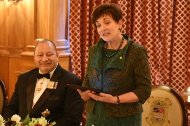 IMage of Dame Patsy speaking at the dinner for the King and Queen of Tonga