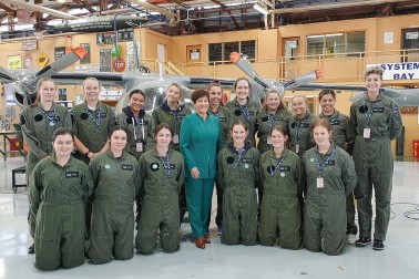Image of Dame Patsy with students in the Logistics Training Squadron hangar