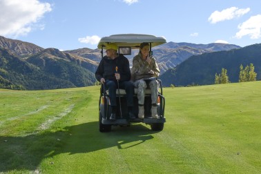 Image of Sir David Sir David and ADC Capt Grace Blanks cruising on the back of the golf cart