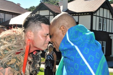HE Major General (Rtd) Lineo Bernard Poopa greeting a member of the cultural party