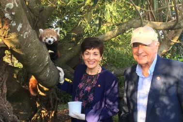 Image of Dame Patsy and Sir David with a red panda