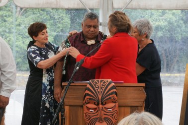 Image of the korowai being placed around the shoulders of Jason Kerehi, Chairperson, Rangitāne Tū Mai Rā Trust.