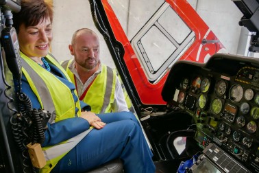 Dame Patsy Reddy in a helicopter at Life Flight 