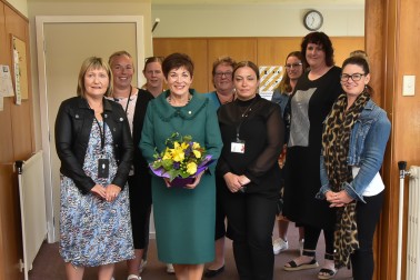 Dame Patsy with personnel from various agencies working under the umbrella of the Community Networking Trust