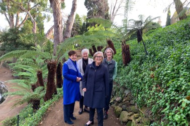 dame Patsy and others in the garden at Government House in Hobart
