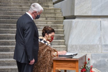 Dame Cindy Kiro signing the visitor's book