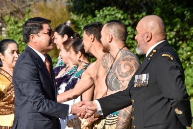 HE Mr Sinchai Manivanh greeting members of the Royal New Zealand Navy cultural party