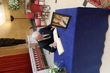 Dr Richard Davies signing the condolence book
