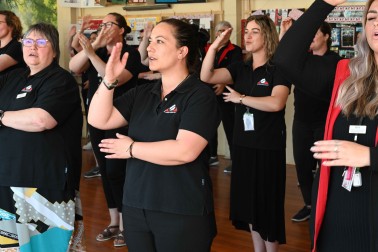The team at Arowhenua Whanau Services performing a waiata