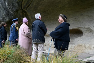 At a second site, Their Excellencies see a spot where travelers have written their names
