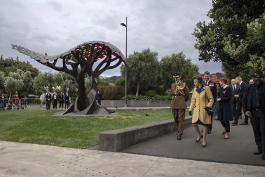 HRH being led around the United Kingdom Memorial