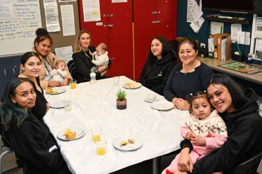 Dame Cindy having morning tea with some of the students and their children