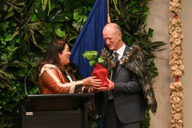 Dame Cindy giving a gift to Mr Bruce Wills, in his last event as Chairman of the QEII National Trust