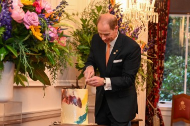 The Duke of Edinburgh cuts the 60th birthday cake.