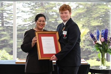 Dame Cindy presenting John Taylor with his certificate