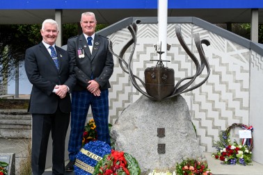 Dr Davies and Andy Fraser next to the Ōtaki College memorial to the SS Ōtaki