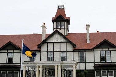 The flag of Tokelau flying outside Government House