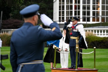 AM Davies receives a salute from the Guard of Honour