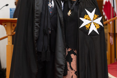 Dame Cindy presents Dr Davies with his Commander of the Order of St John