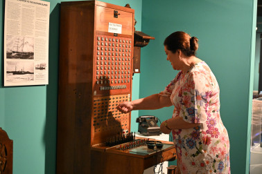 Dame Cindy demonstrating the operation of a telephone exchange at the Chatham Islands Museum