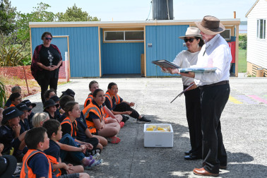 Dame Cindy and Dr Davies brought fruit and books for the school
