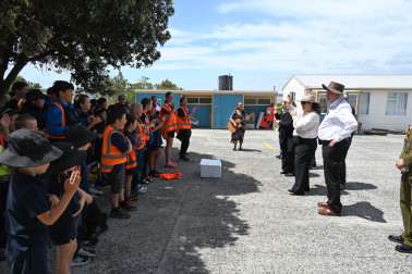 Dame Cindy and the children of Te One School performing 'Tutira Mai'