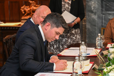 Mr Meager signing his affirmation documents