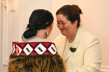 Dame Cindy congratulating recipient Rachel Puru