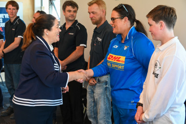 Dame Cindy meeting one of the surf-lifesaving volunteers