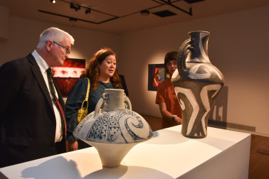 Dame Cindy and Dr Davies with two works by Baye Riddell at the Wairau Maori Art Gallery