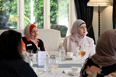 Faieza and Ala listening to the speeches