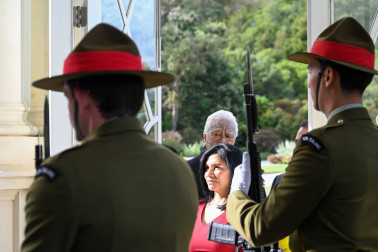 HE Ms Isaura Duarte walks through the Guard of Honour