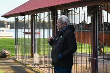 Joe Harawira stands by a replica of the waka Mātaatua