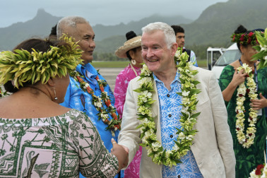 Dr Davies meeting the official welcoming party on the tarmac