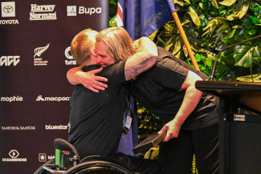Jane Stevens congratulates Paralympian #188 Corey Peters